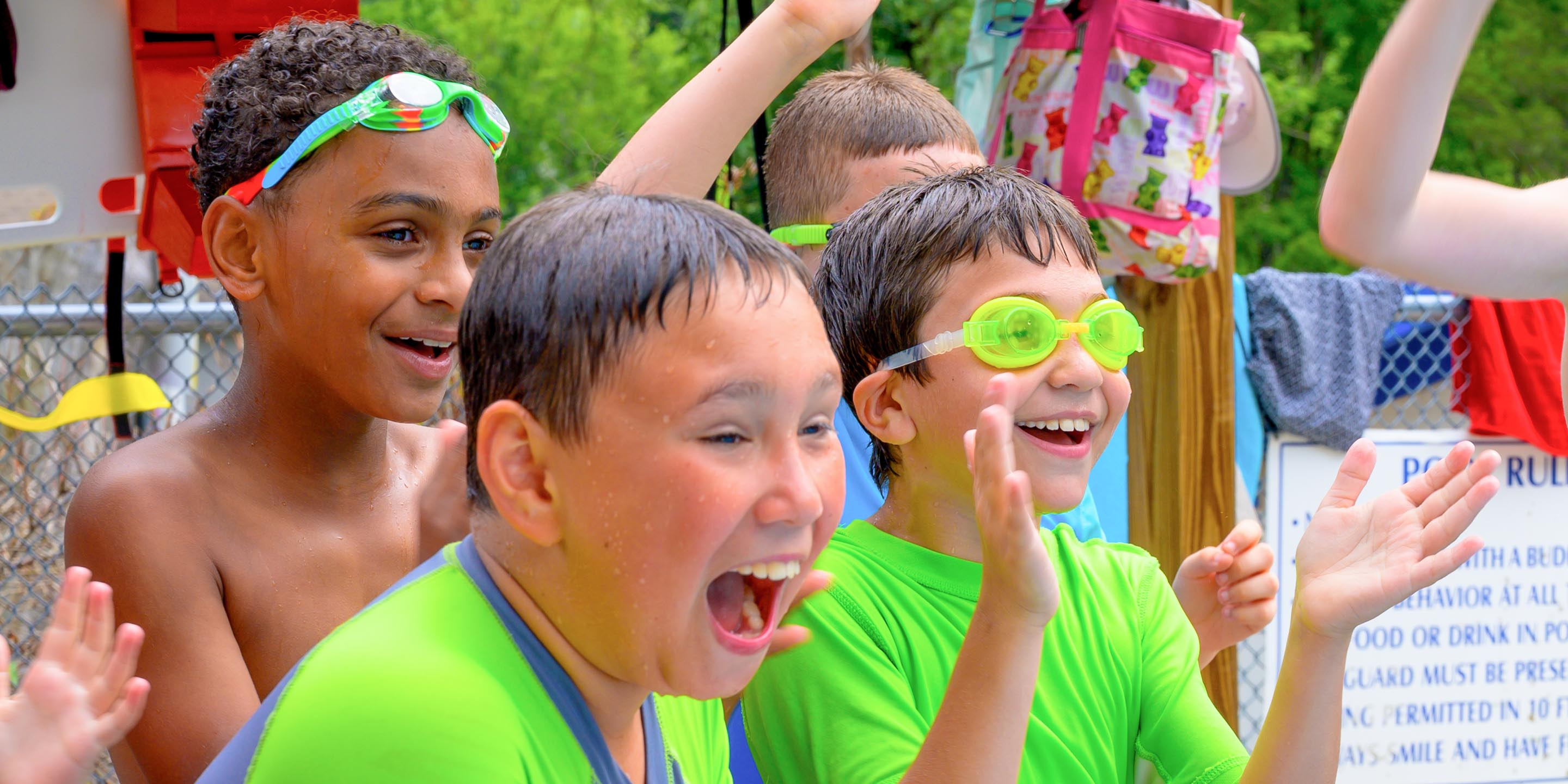 Boys cheering during water sports activity