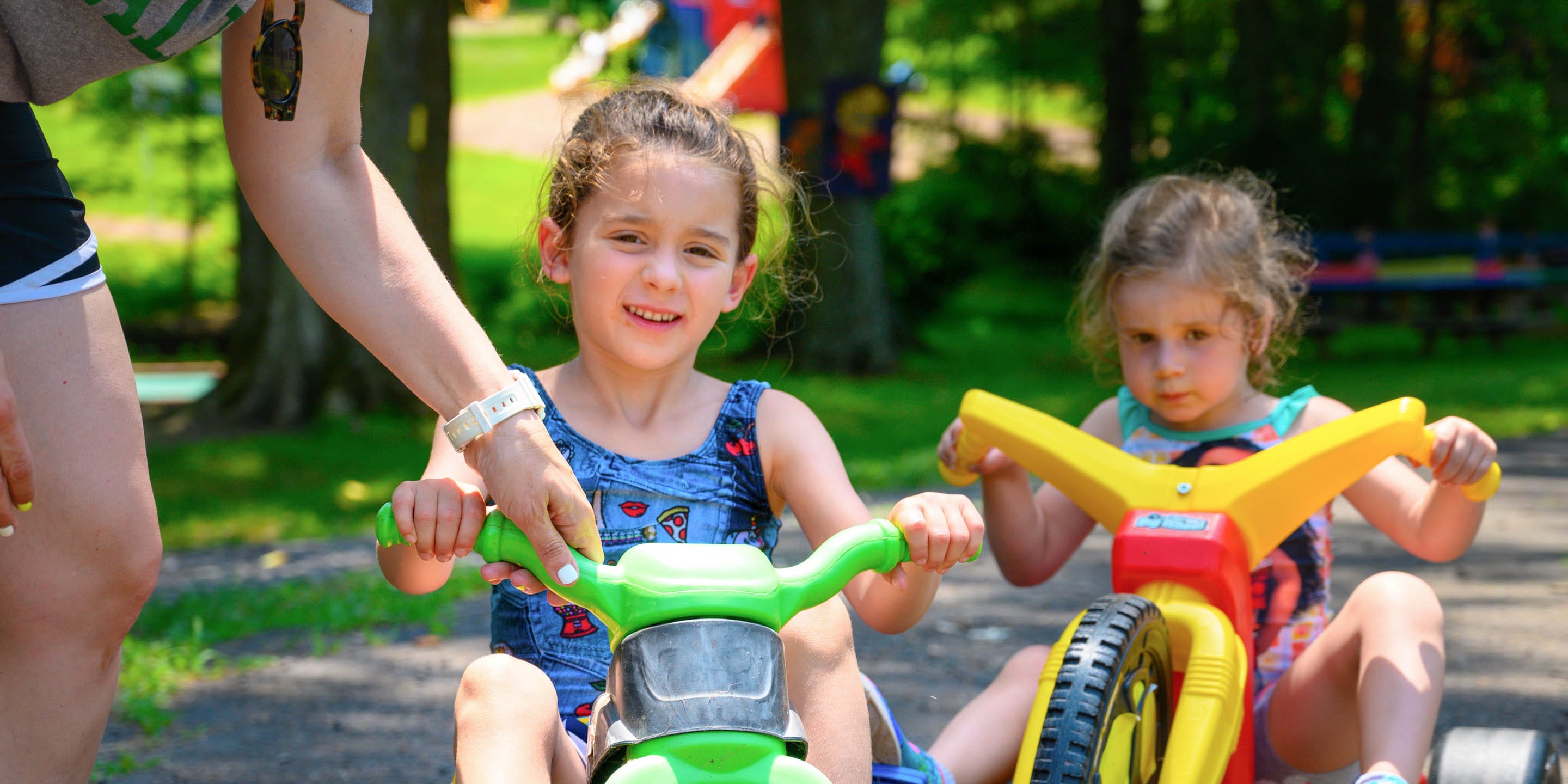 Young campers riding cycles