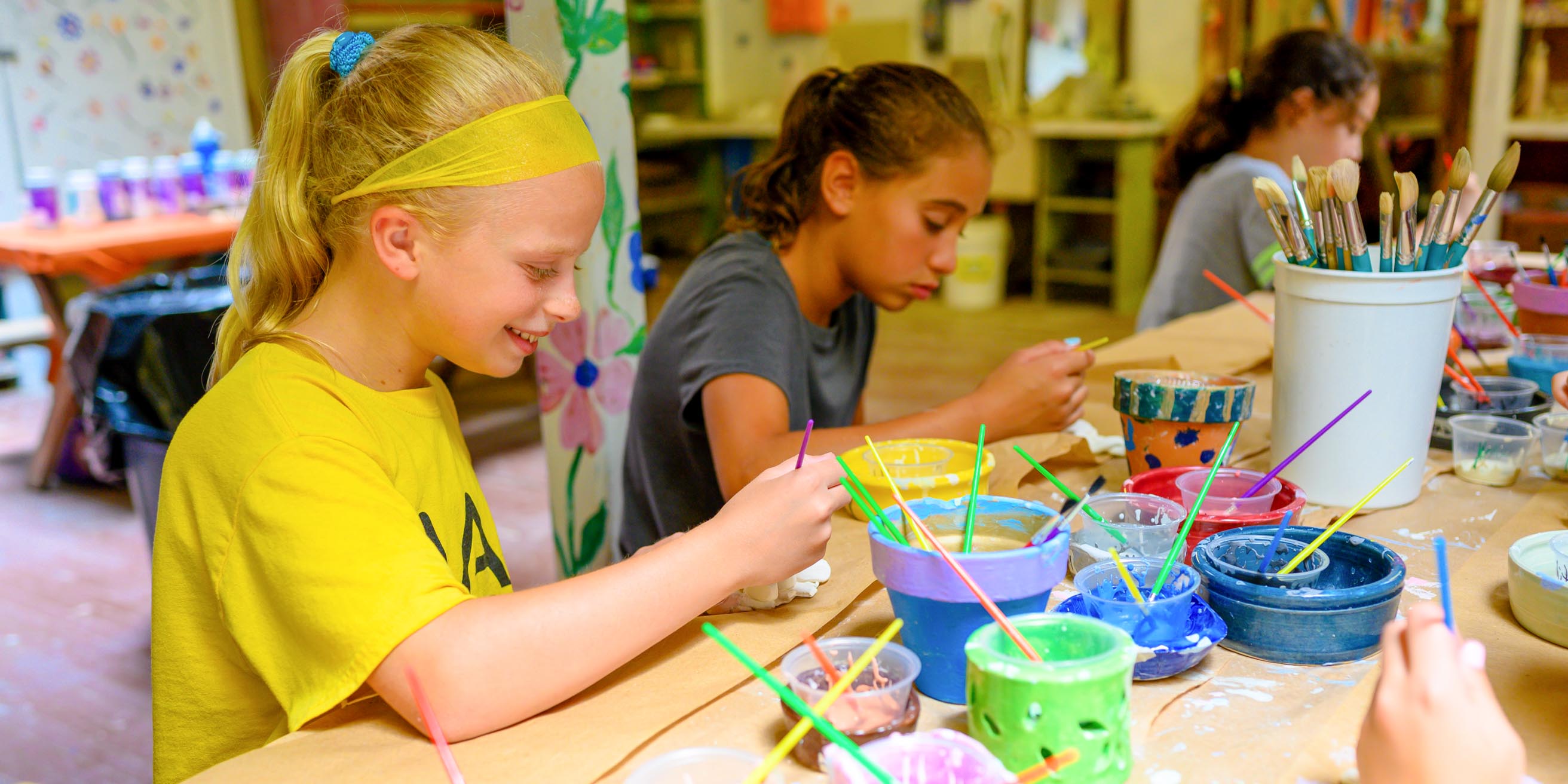 Girls painting ceramics