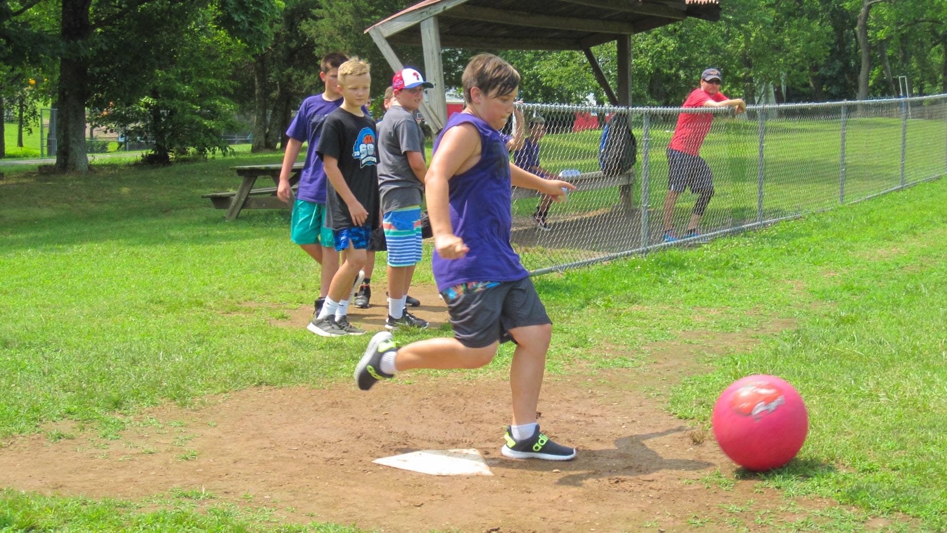 Boys playing a game of kickball