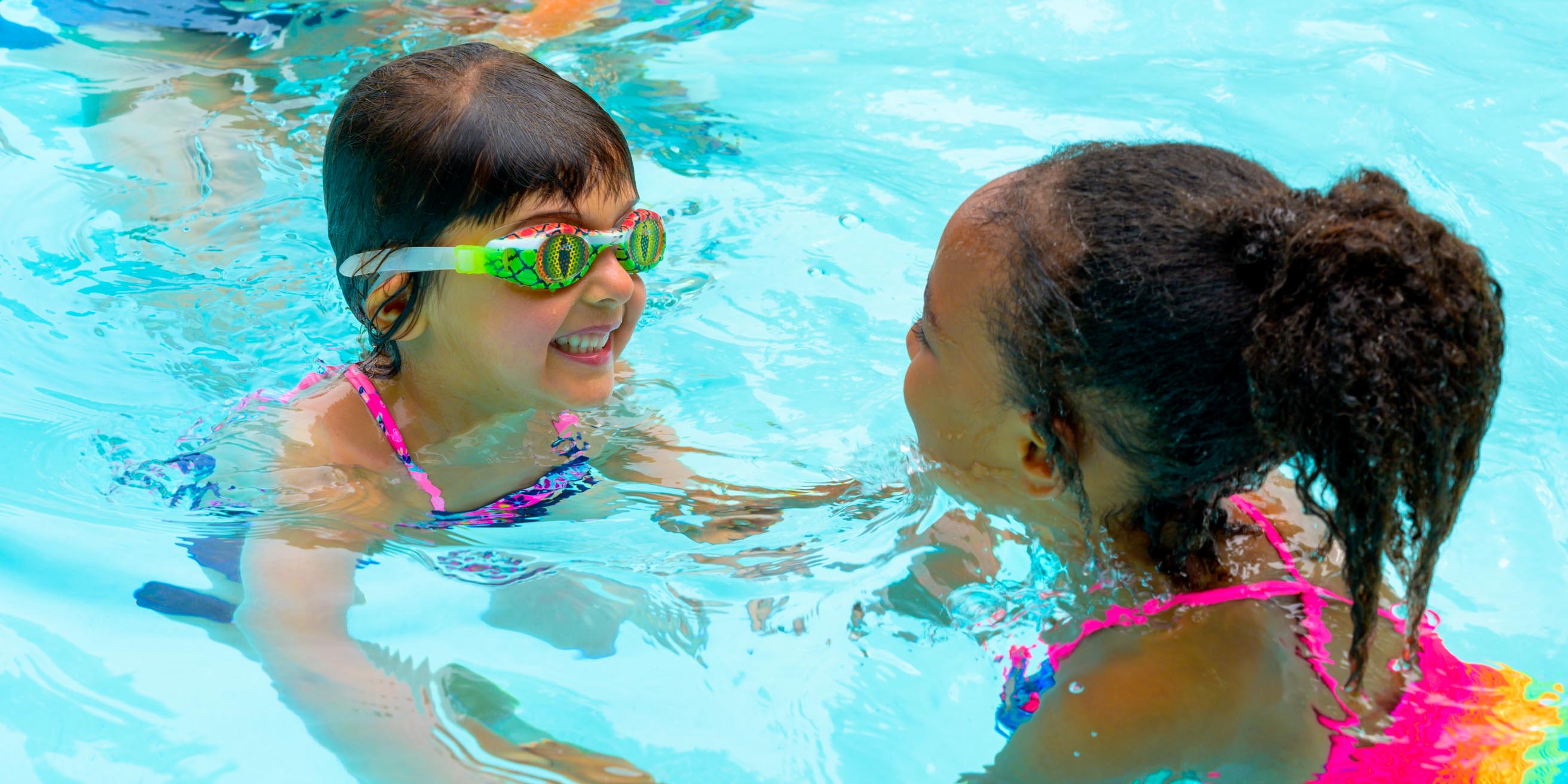 Girls laughing in pool