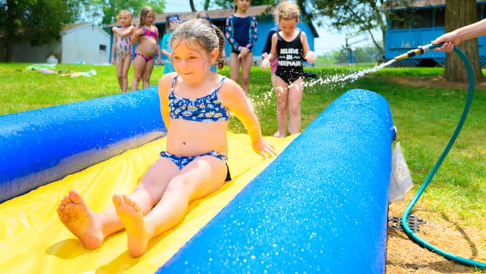 Camper sliding down waterslide