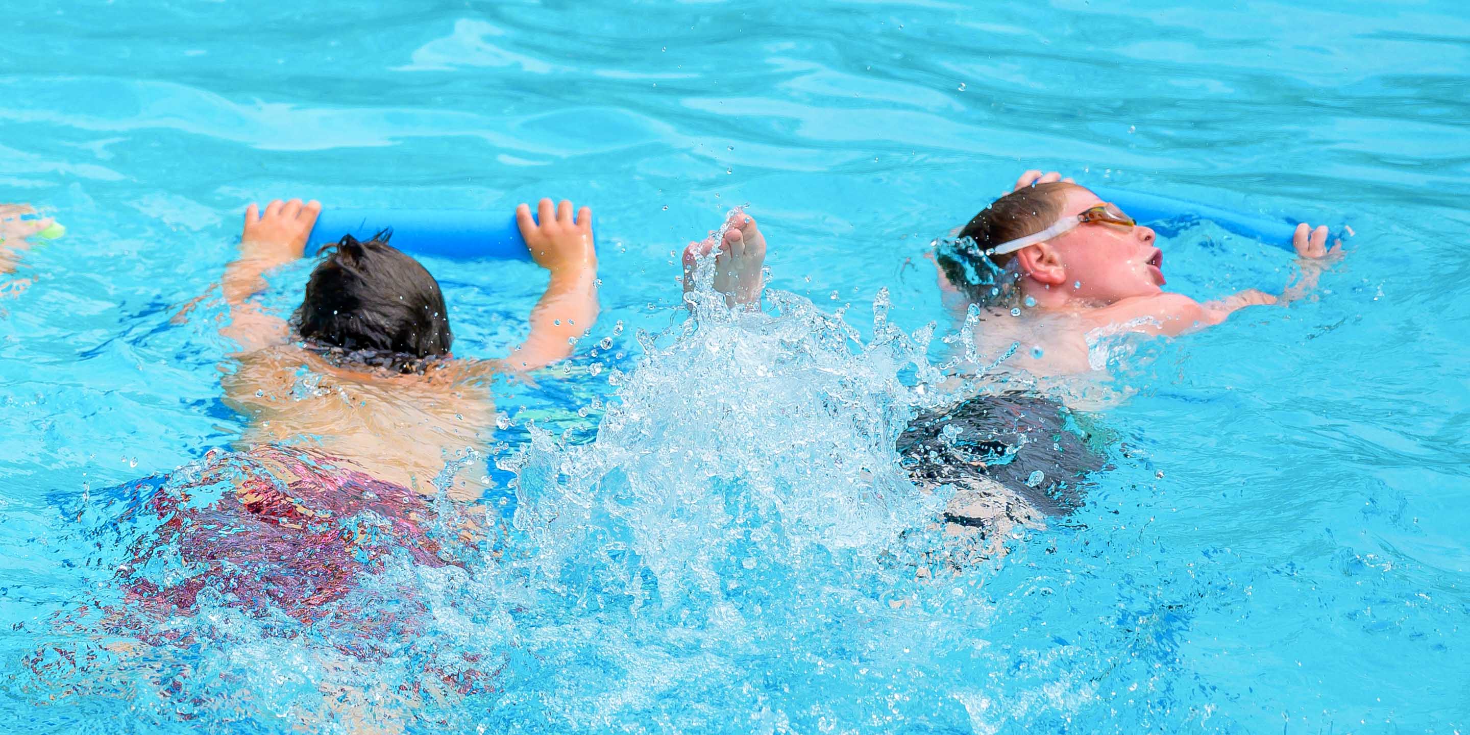 Boys swimming in pool