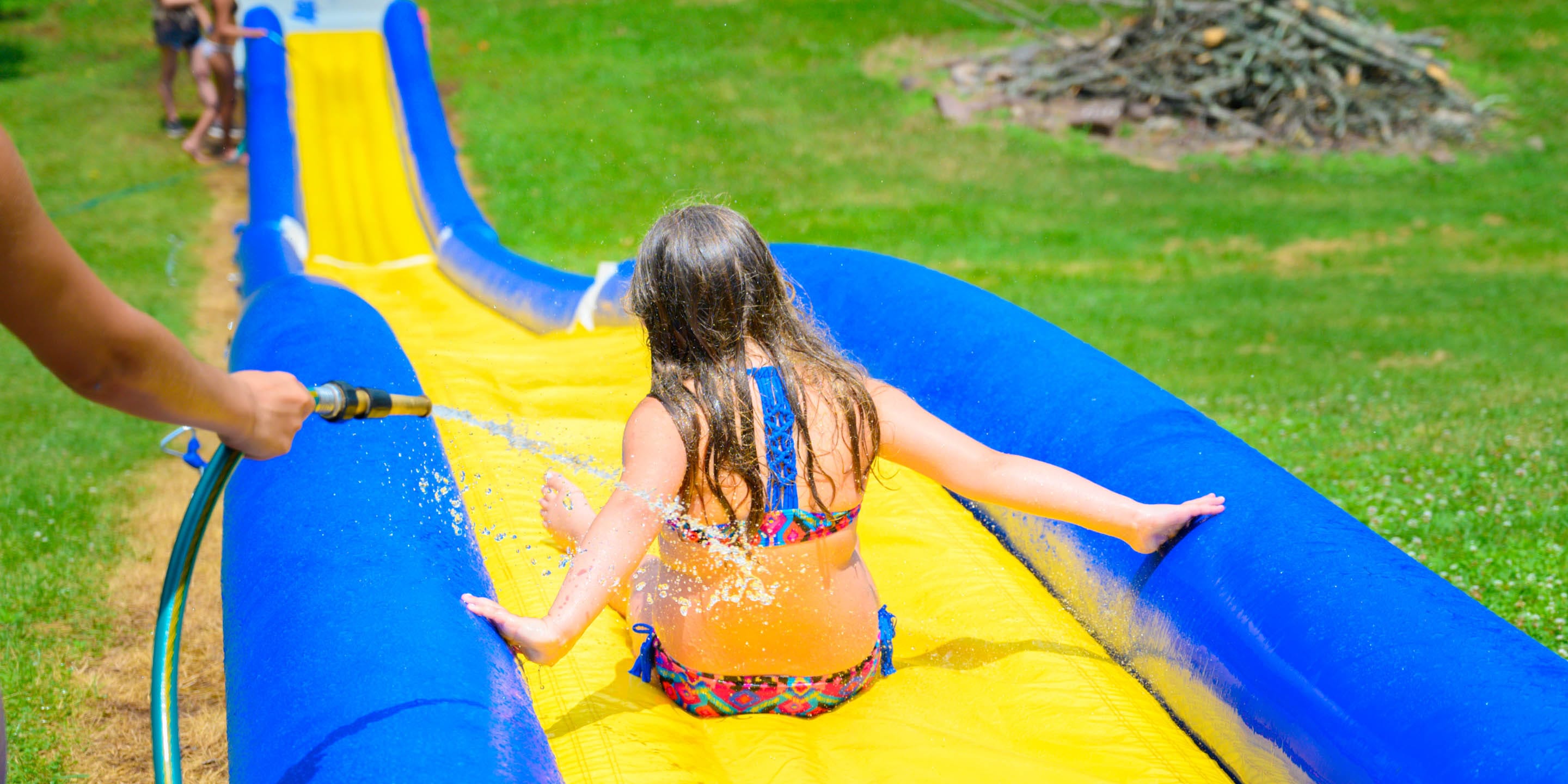 Girl going down waterslide