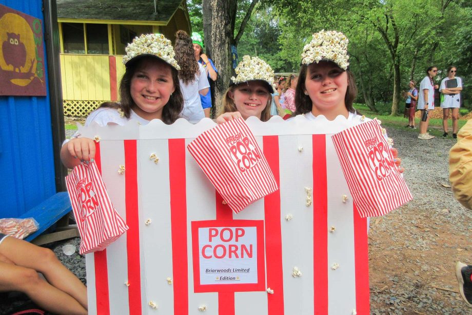 Three girls wearing a popcorn costume