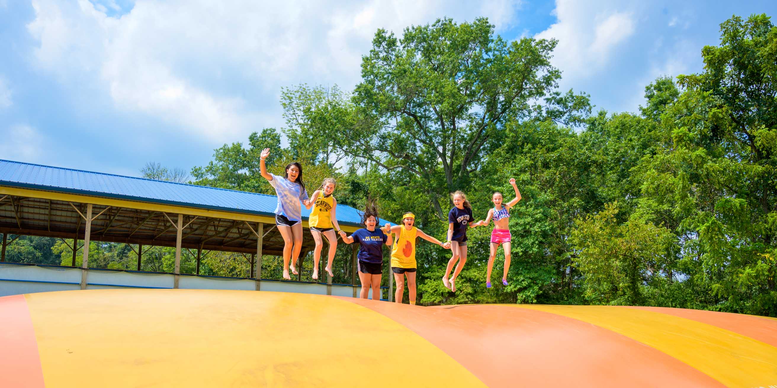 Girls on jumping pillow