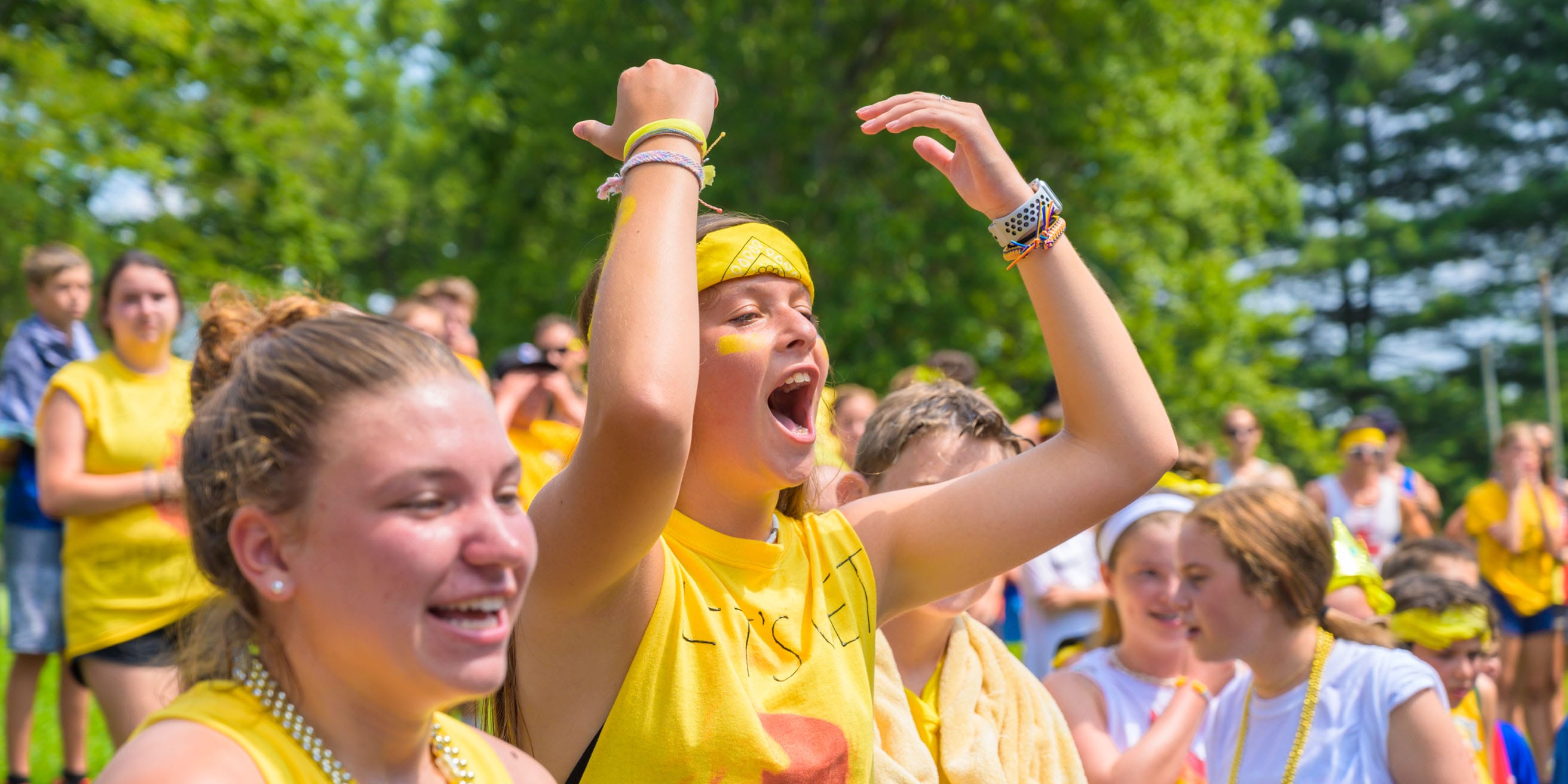 Girls cheering during color war