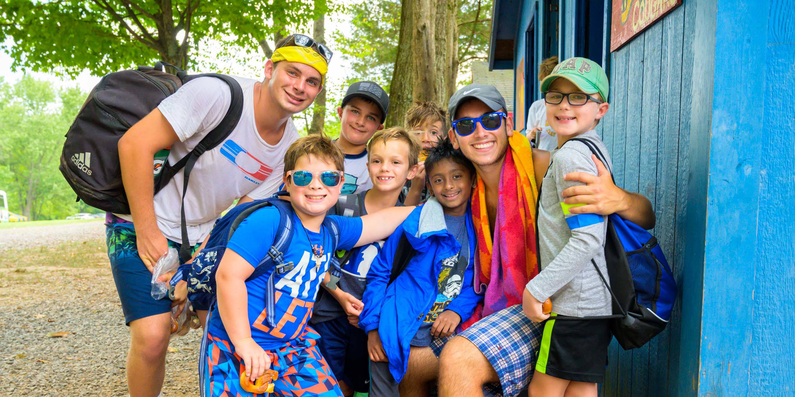 Staff and kids smiling outside