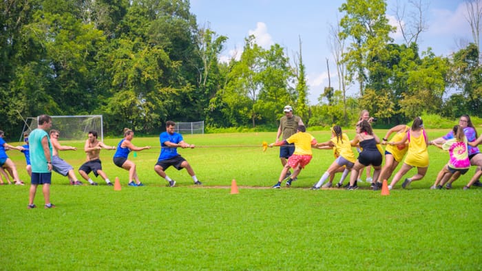 Adults playing tug of war