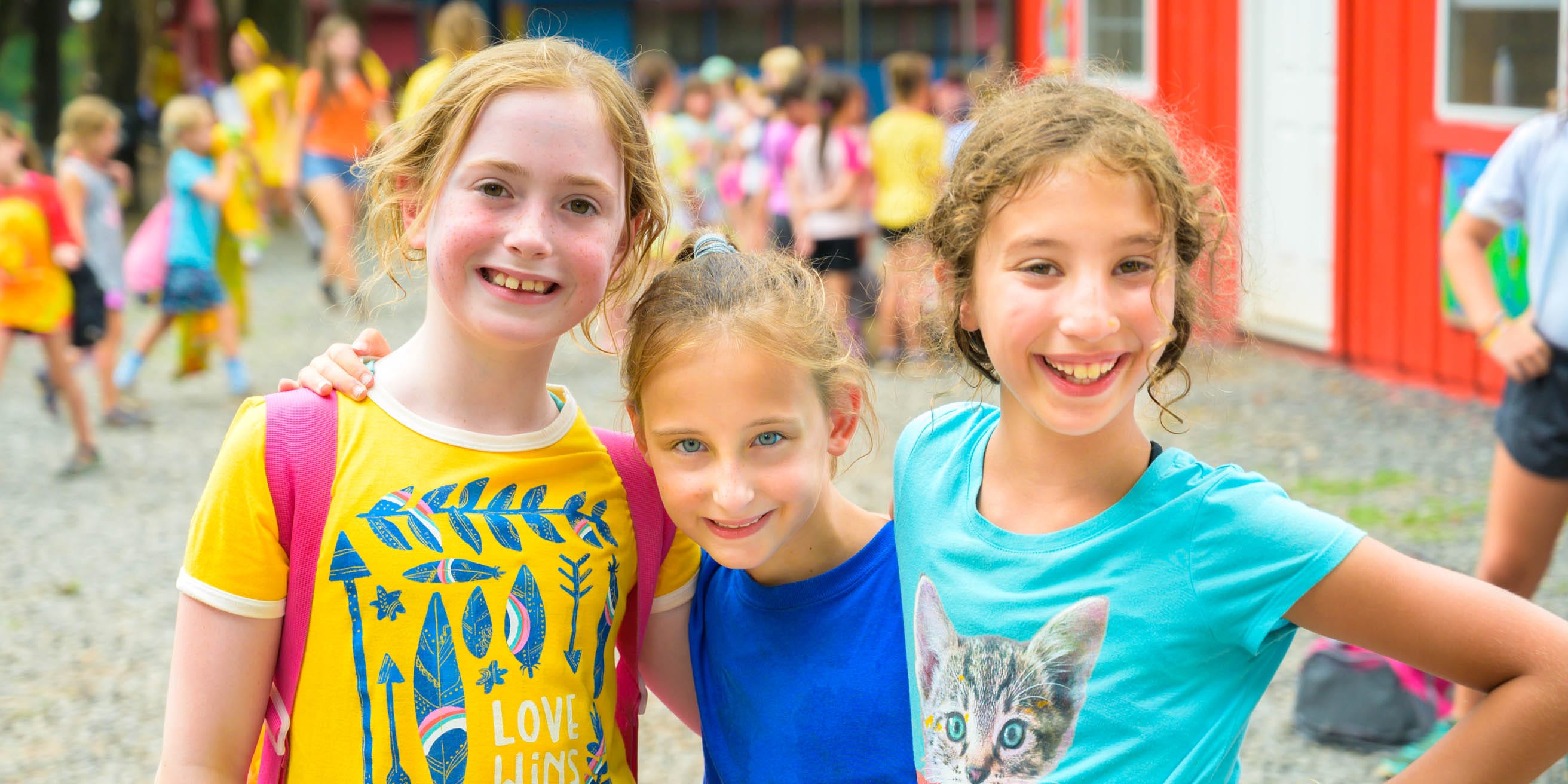 Three happy girls smiling