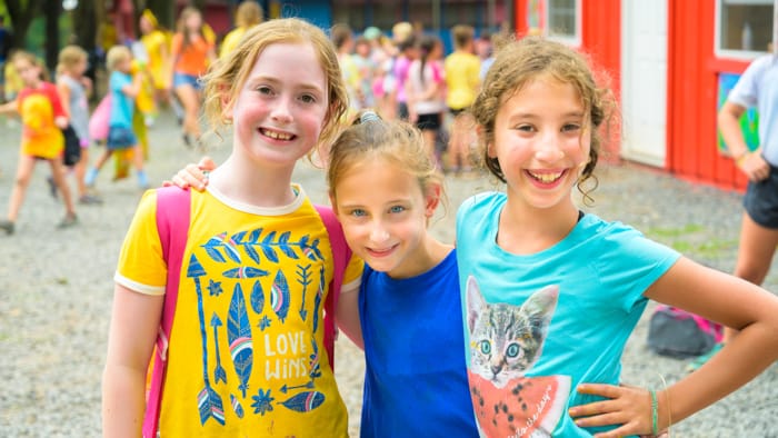 Three happy girls smiling