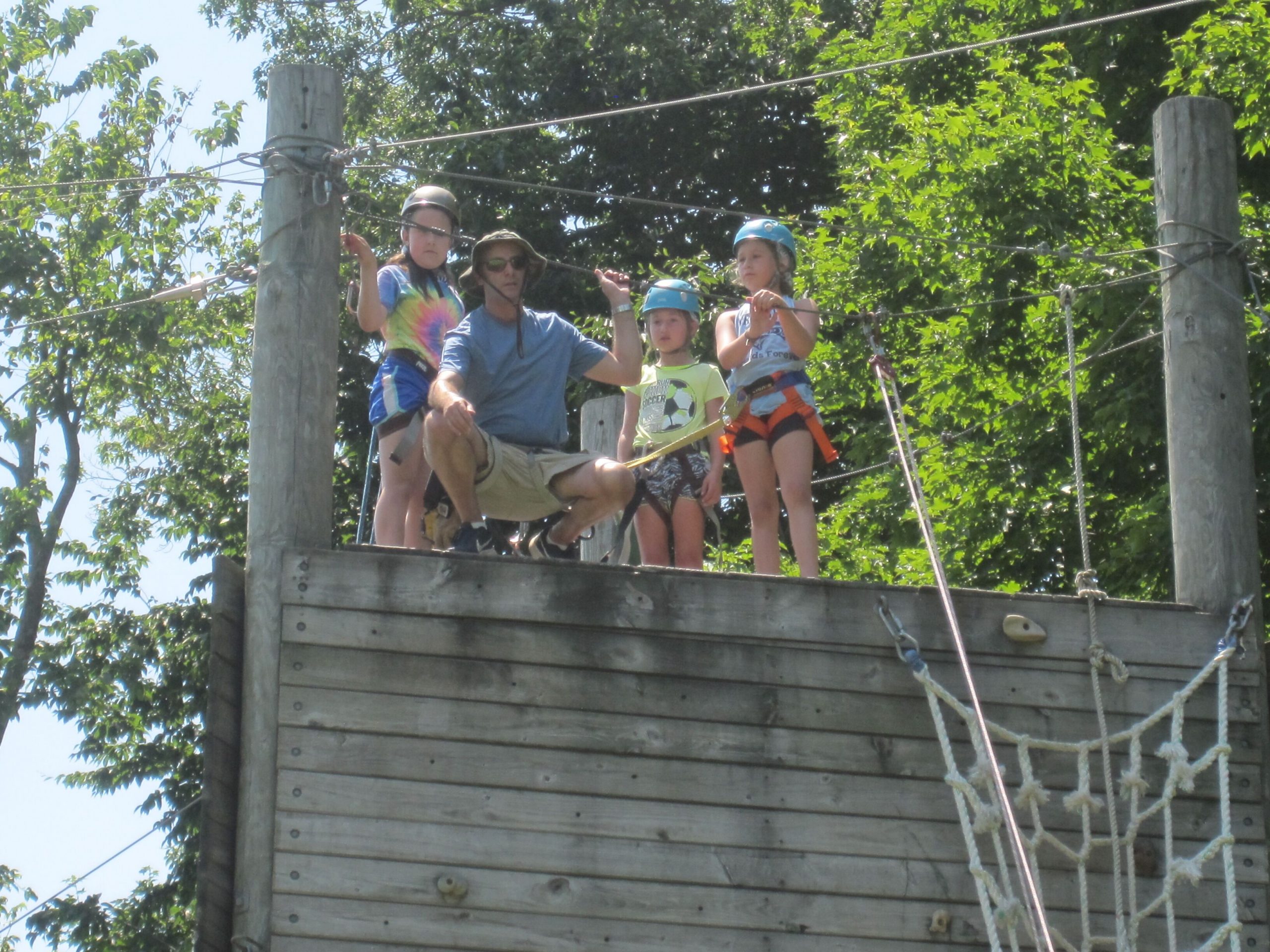 kids at the top of the rock climbing wall