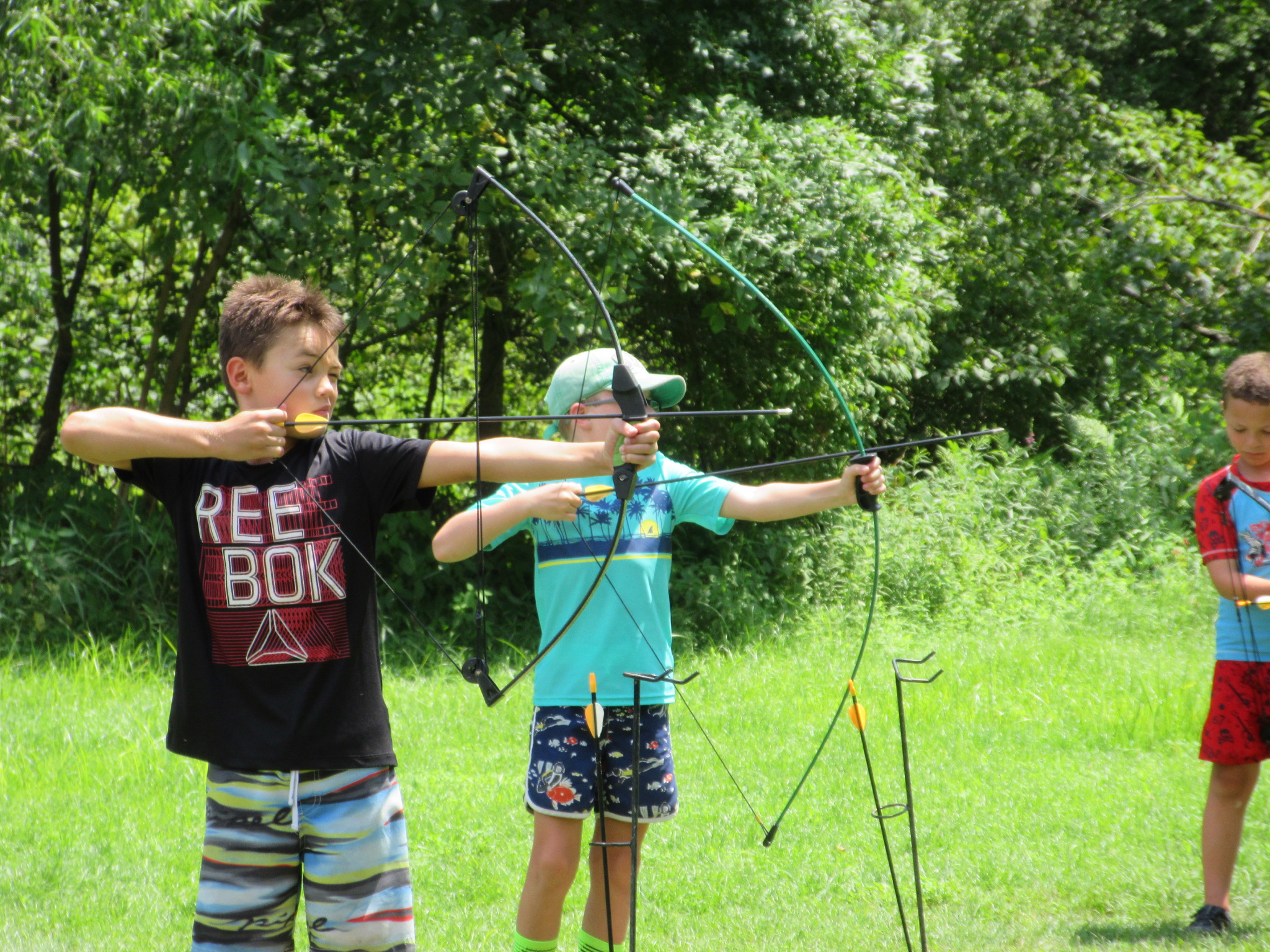 children practicing archery